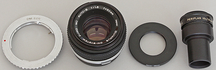 OM-EOS adapter, Zuiko 50mm lens, 49–28mm step-down ring, Periplan 10× eyepiece